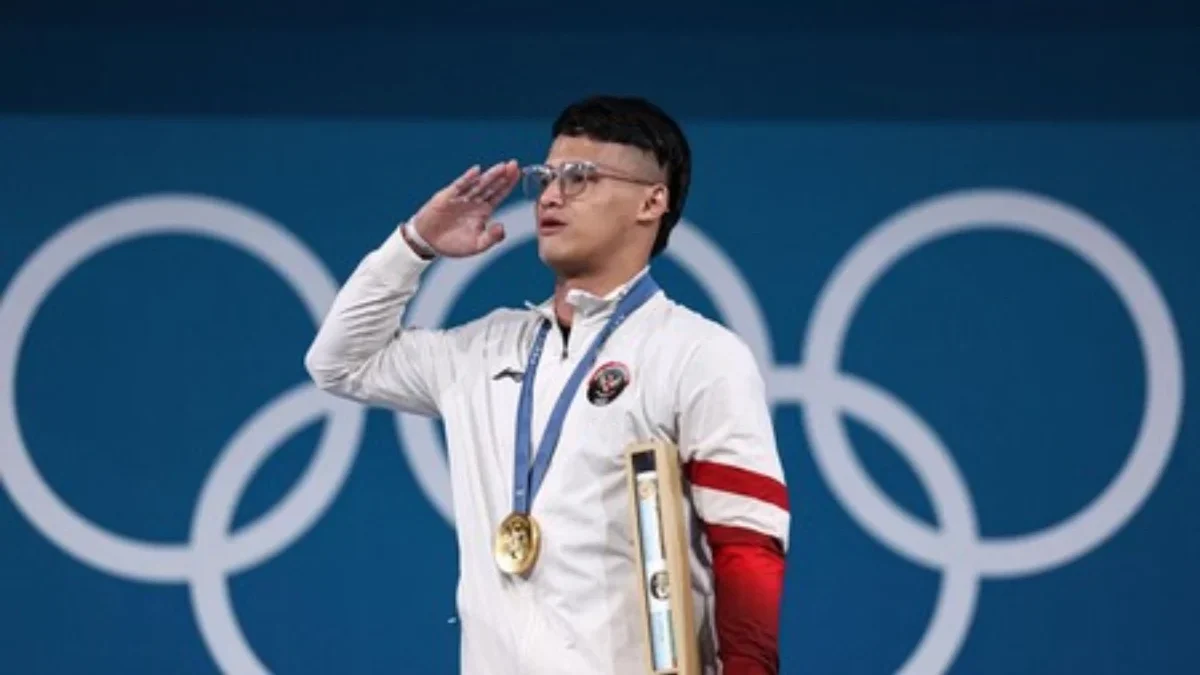 Atlet angkat besi Indonesia Rizki Juniansyah yang turun di nomor 73 kg pada Olimpiade Paris 2024 sukses